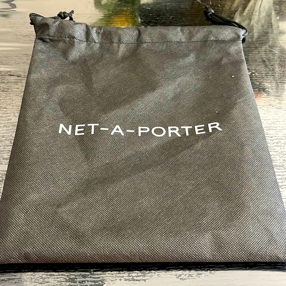 Black drawstring dust bag NWOT.